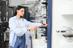 Woman choosing a shower head in a hardware store.