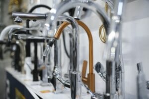 Modern kitchen and bathroom water faucets in the store.